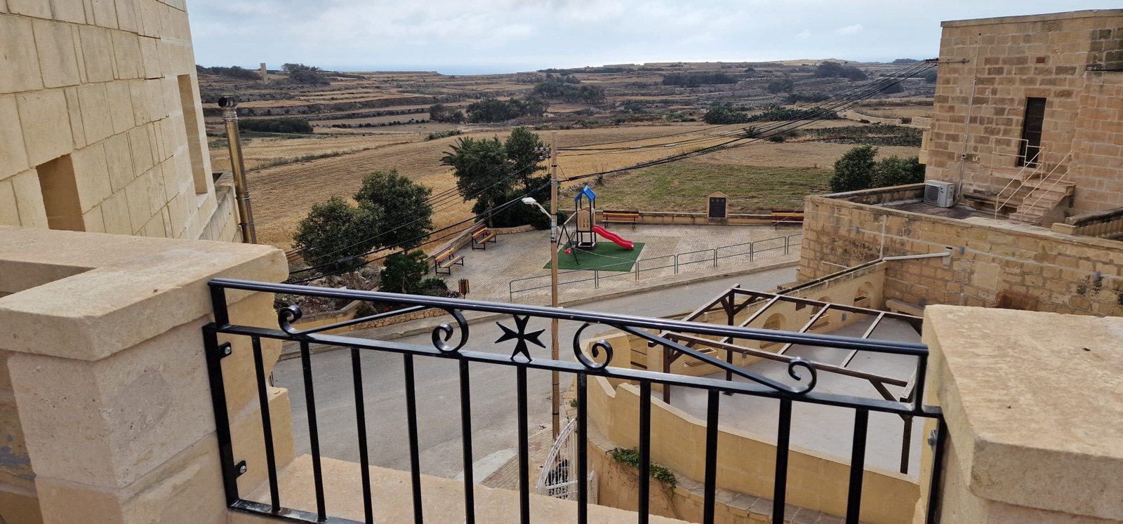 Countryside view and the public playground opposite Molendini